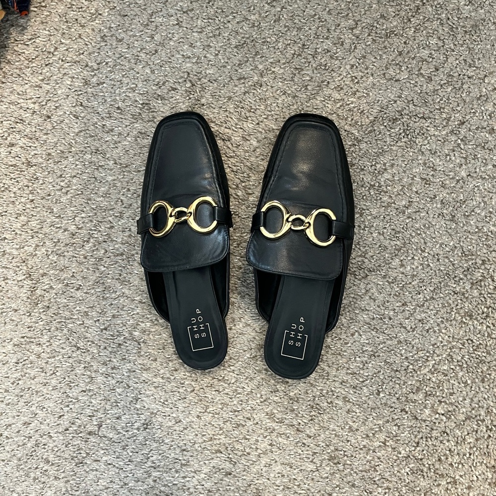 Elegant Black Leather Loafers with Gold Accents